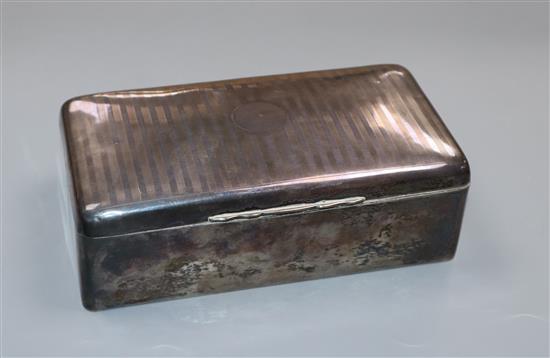 A George V silver cigarette box, 17.2cm.